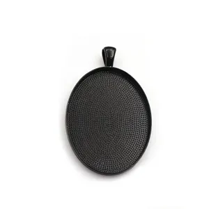 Plateau pendentif ovale noir en alliage 30x40mm pour fabrication de bijoux DIY détail.