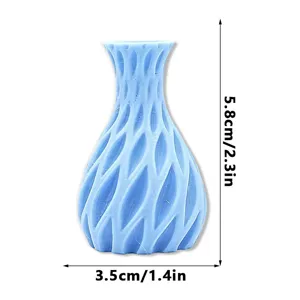Close-up detail of a blue 3D printed magnetic vase fridge magnet showcasing unique wave texture.