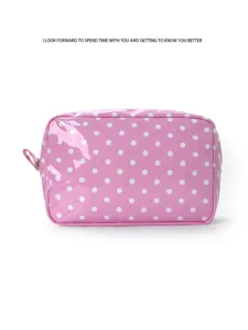Waterproof pink polka dot cosmetic bag detail, showing shiny patent surface and side zipper.