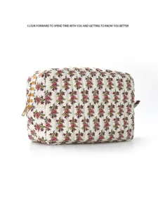 Detailed view of the quilted floral cosmetic bag, featuring soft fabric and zipper closure.
