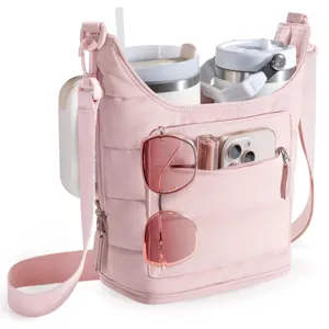 Pink quilted water bottle sling bag with adjustable strap, multi-pocket crossbody bag for outdoor.