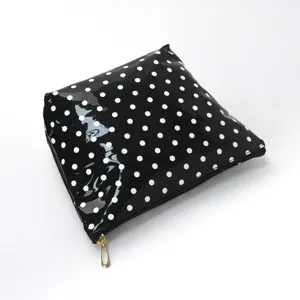 Stylish black glossy polka dot cosmetic bag for travel daily makeup storage pouch.
