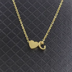 Stainless steel gold-colored necklace with heart and letter C charm, detailed jewelry close-up view