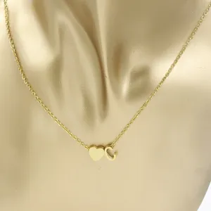 Gold stainless steel necklace featuring a cute heart pendant and initial letter C charm.