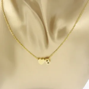 Gold stainless steel heart and letter B pendant necklace, minimalist fashion jewelry detail.