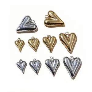 Stainless steel puffy heart charms pendants in gold and silver, ideal for DIY jewelry making.