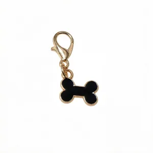 Gold-tone alloy lobster clasp with a black enamel bone charm pendant for DIY jewelry crafting.