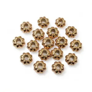Stainless steel gold pumpkin spacer beads for DIY jewelry making, charm bracelets, and crafting.