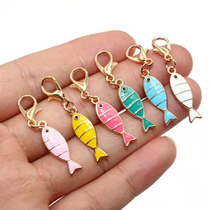 Gold alloy enamel fish pendant detail showing colorful cute charms with lobster clasp.
