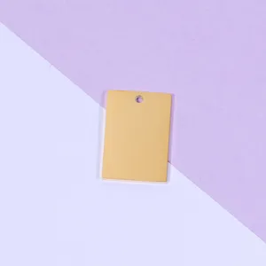 Detailed shot of a smooth gold rectangular stainless steel DIY pendant blank charm accessory.