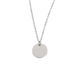 Stainless steel round disc pendant necklace detail, blank shiny DIY jewelry component.