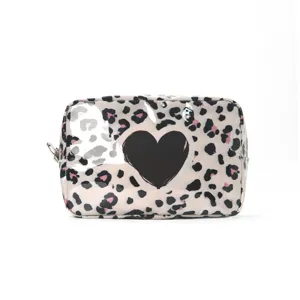 Waterproof leopard print cosmetic bag with black heart design, portable travel makeup pouch.