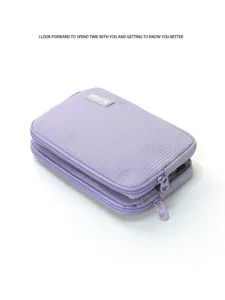 Detailed view of the purple detachable travel cosmetic storage bag with double layers.