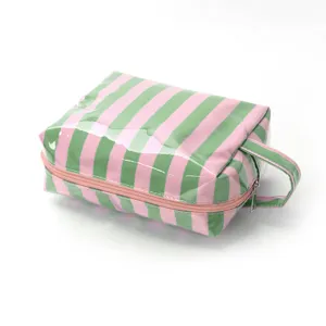 Striped cosmetic bag for travel and daily organization with a durable pink zipper.