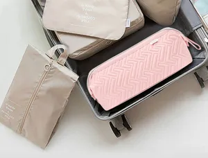 Borsa da viaggio portatile per asciugacapelli e arricciacapelli, custodia trapuntata rosa.