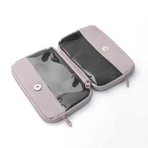 Detachable cosmetic travel storage pouch with clear compartments and secure zipper closure.