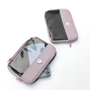 Purple travel cosmetic pouch with transparent window and zipper, portable makeup organizer bag.