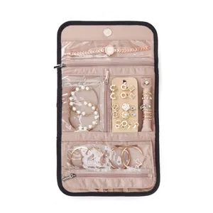 Travel jewelry organizer bag foldable portable jewelry storage roll pouch with clear pockets.