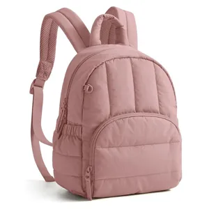 Pink quilted backpack detail view, casual lightweight daily commuter shoulder bag for women.