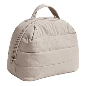 Quilted makeup bag detail view, portable cosmetic pouch with convenient top handle zipper.