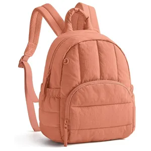 Chic quilted mini backpack for women, lightweight commuting style with soft peach pink finish.