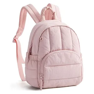 Detailed view of the stylish quilted mini backpack in soft pink, lightweight commuter design.