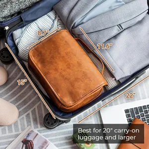 Detailed shot of brown PU travel toiletry bag packed neatly inside carry-on luggage.