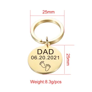 Stainless steel keychain detail showing 25mm round pendant size and custom dad engraving.