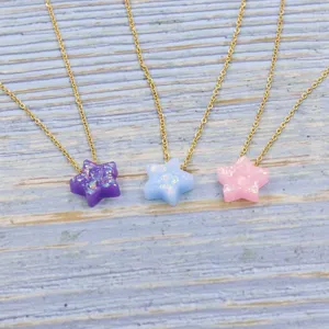 Gold stainless steel chain necklace featuring colorful resin star pendants for daily charming wear.