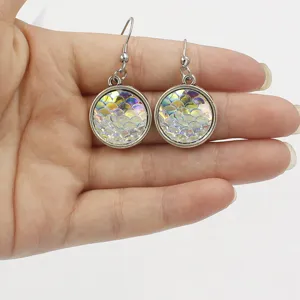 Detail shot of charming mermaid scale resin earrings with titanium steel hooks for daily wear.