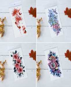 Waterproof temporary tattoo stickers featuring floral, butterfly and vintage clock designs for body art.