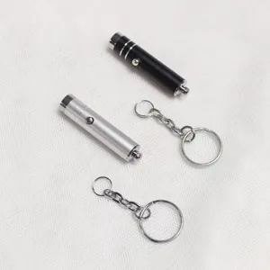 Mini linterna UV portátil con luz violeta y llavero para uso diario y práctico.