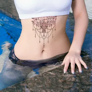 Closeup detail of waterproof floral temporary chest tattoo sticker showing elegant lace design.