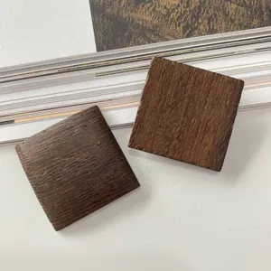 Close-up detail of 25mm square wooden DIY earring components, non-perforated geometric design.