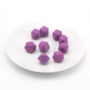 Purple faceted wood beads detail view showing multi-angle geometric bead craftsmanship.