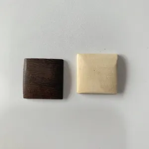 Wooden square piece detail shot, handmade polished wenge wood accessory for DIY earrings.