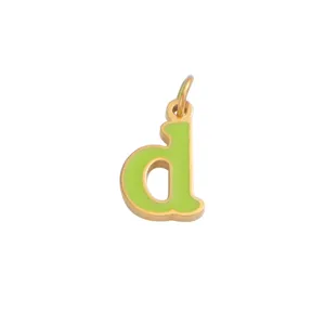 Close up view of gold plated lowercase letter d pendant featuring vibrant light green enamel design.