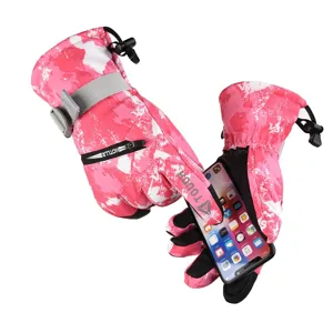 Pink camo winter ski gloves detail, waterproof thermal outdoor gear with touchscreen fingertips.