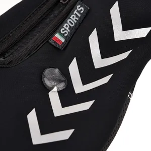 Close-up detail of waterproof sports zipper pocket with reflective chevron arrows.