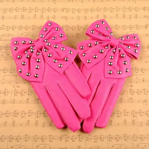 Gants en cuir PU rose avec un grand noeud et des rivets metalliques pour la danse.