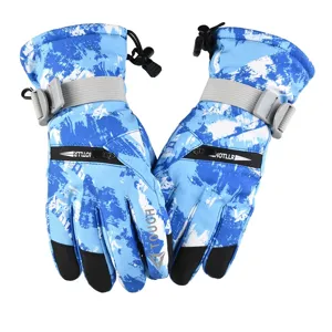 Detailed view of waterproof winter ski gloves with blue camo, touch screen and warm fleece lining.
