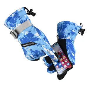 Detailed view of winter ski gloves showing touchscreen compatibility with smartphone.
