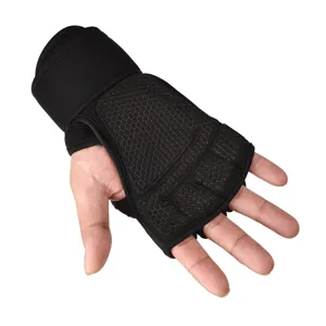 Detailed view of black gym fitness gloves with integrated wrist wraps and honeycomb palm pads.