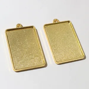 Gold alloy rectangular pendant bezel tray 38x25mm inner diameter DIY jewelry accessory detail.