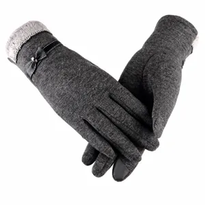Close-up of grey fleece-lined knit women's gloves with cute bow and touch screen design.