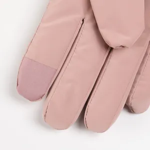 Winter ski gloves women fleece waterproof windproof touch screen warm outdoor pink close-up.