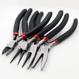 Close-up detail of a set of mini DIY jewelry pliers with black handles and red rings.