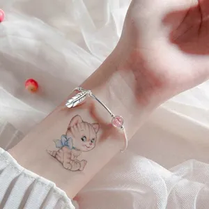 Cute cartoon cat temporary tattoo sticker with sweet design, great for body art and fashion.