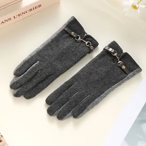 Detailed shot of dark grey women's wool touchscreen gloves with leather strap and metal buckle.