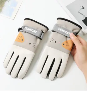 Close-up detail of the cute cartoon cat warm cycling gloves, featuring adjustable wrist strap.